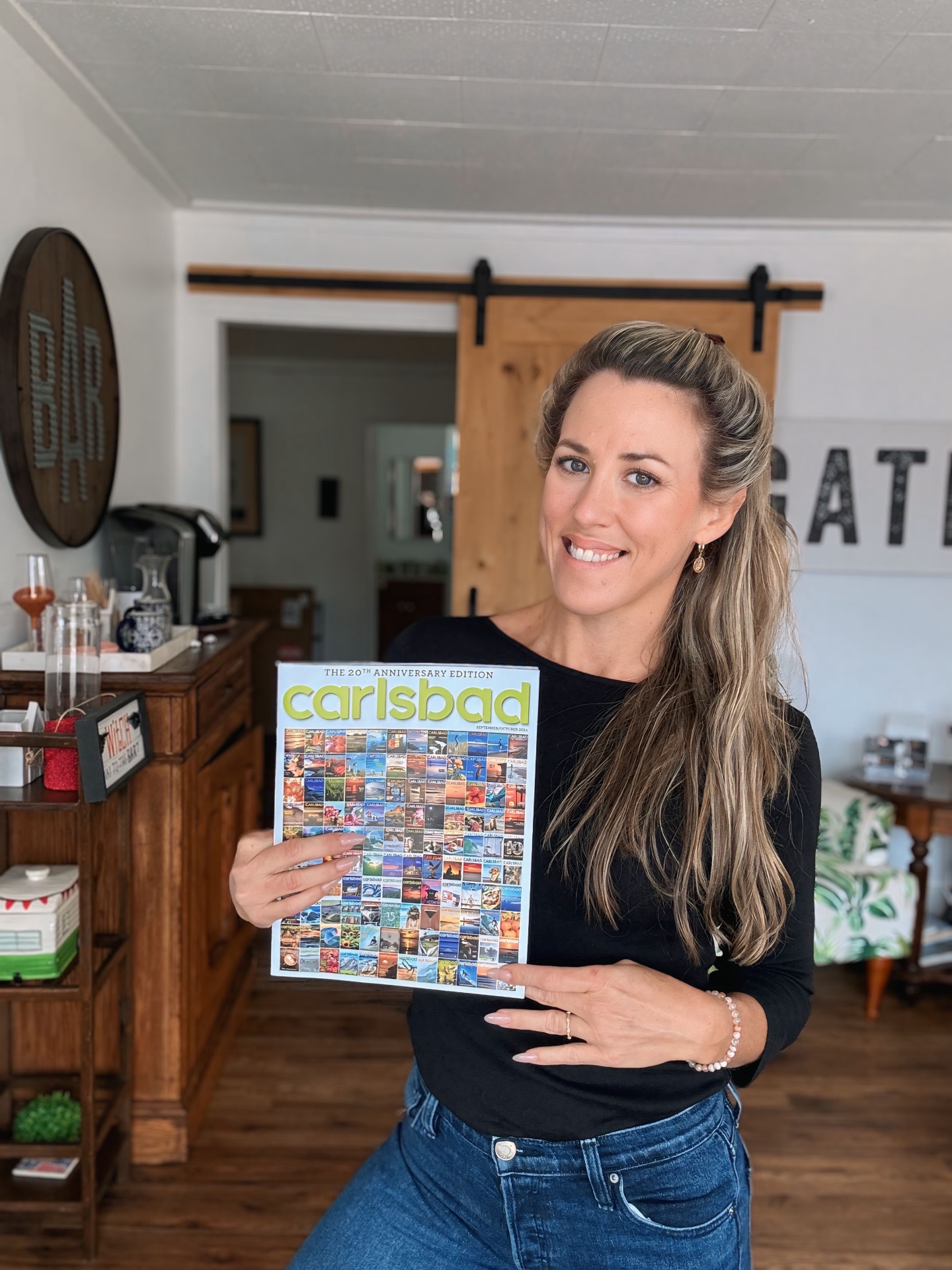 Hayden Goldberg holding Carlsbad Magazine